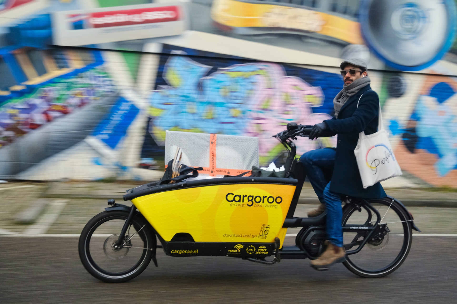 A Cargoroo rider crossing Amsterdam with cargo on board